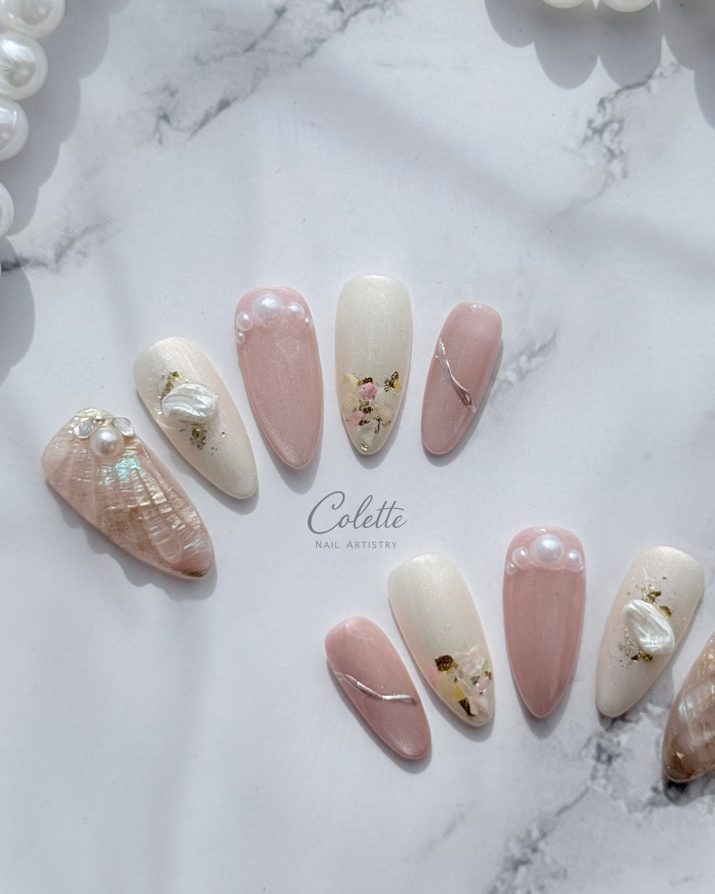 Complete set of Pearl Mist press-on nails.