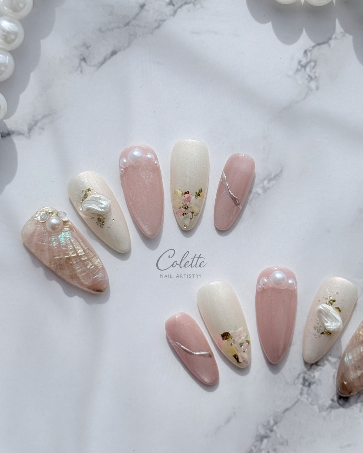 Complete set of Pearl Mist press-on nails.